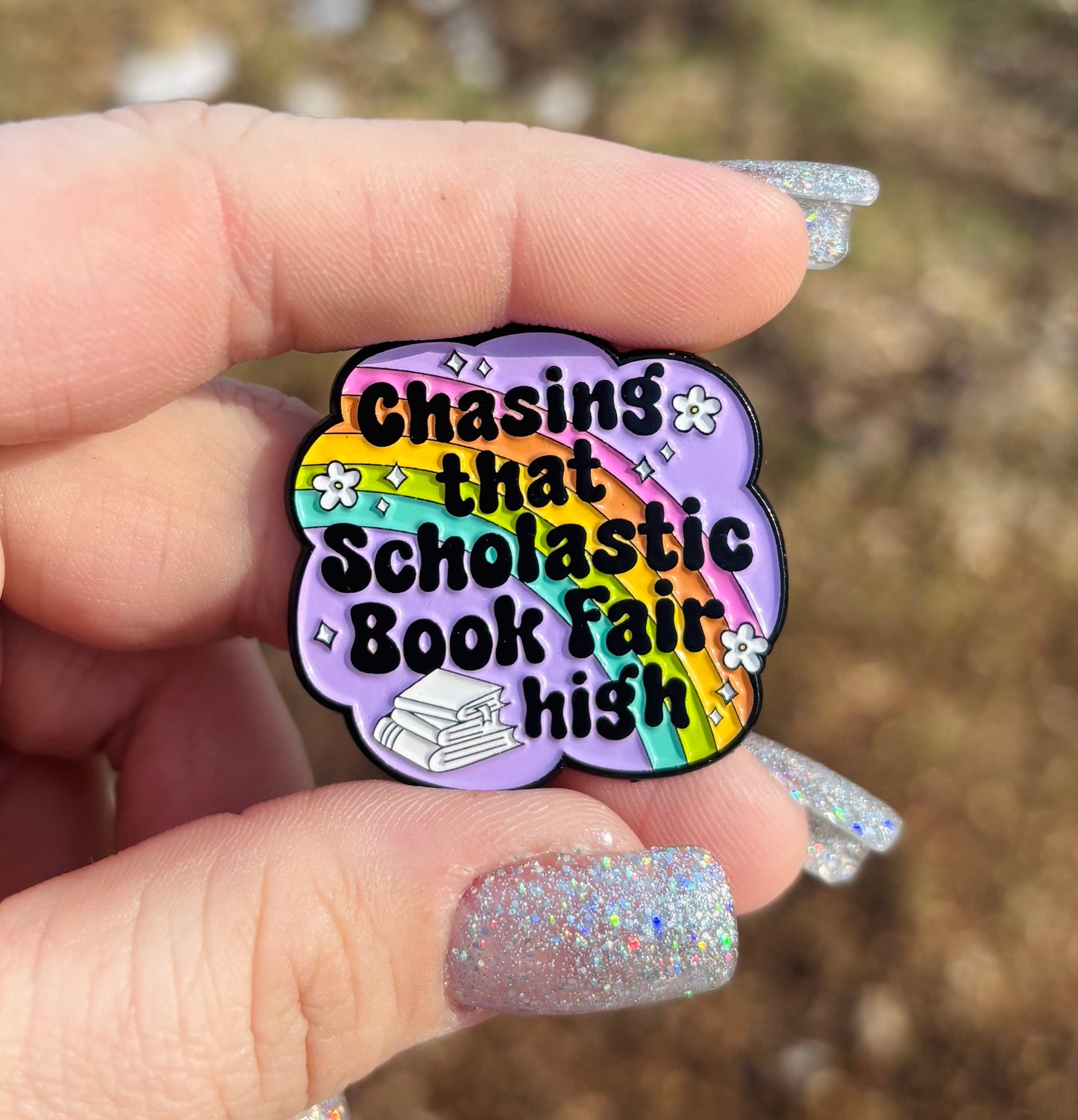 Chasing That Schoolastic Book Fair High Enamel Pin